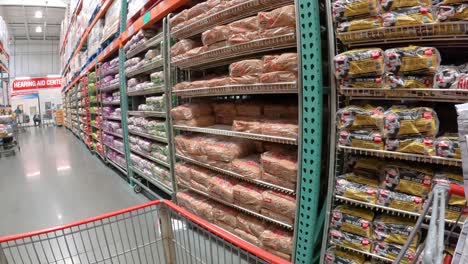 POV---Slowly-pushing-the-grocery-cart-down-the-bread-aisle-at-Costco-towards-the-hearing-center