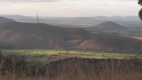 South-Africa,-Savannah-landscape-and-mountains-in-the-evening-sun