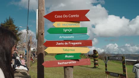 Colorful-Directional-Signpost-in-Podence-Village-during-entrudo,-Portugal