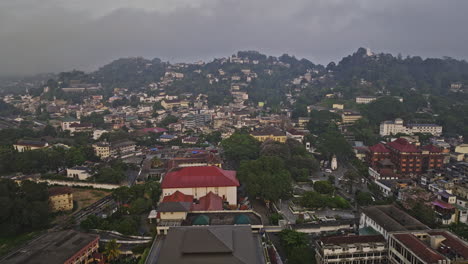 Kandy-Sri-Lanka-Aerial-v23-panoramic-drone-fly-around-city-center-capturing-downtown-cityscape-and-beautiful-landscape-of-lake-and-hilly-terrains-at-sunrise---Shot-with-Mavic-3-Cine---April-2023