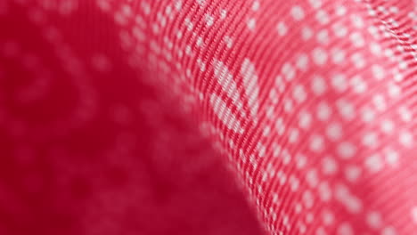 Red-fabric-texture-with-spots-motif