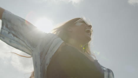 Happy-Festival-Girl-Spins-Around-With-Sun-Flare-in-Slow-Motion