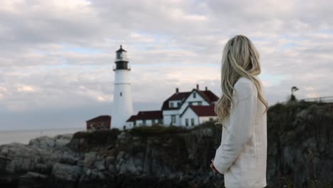 Beautiful-Blonde-Woman-looking-Out-To-Lighthouse