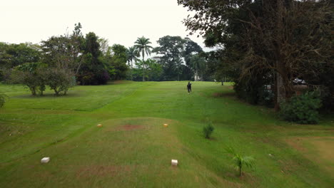 Aerial-view-over-the-Le-Golf-Club-de-Yaoundé-course,-in-cloudy-Cameroon,-Africa