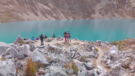 Group-of-tourist-people-enjoy-it-a-beautiful-lake-in-the-peruvian-andes