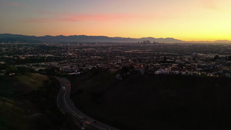 Aerial-drone-shot-over-Downtown-in-Los-Angeles,-California-after-sunset