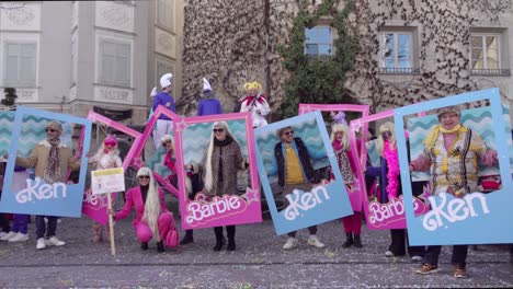 Adults-dressed-as-Barbie-and-Ken-during-the-annual-carnival-celebration-called-Gnoccolada-in-Brixen---Bressanone,-South-Tyrol,-Italy