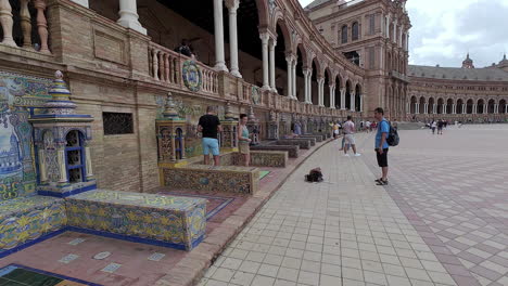 Tourists-taking-pictures-on-the-Plaza-de-Espana-in-Seville-at-daylight