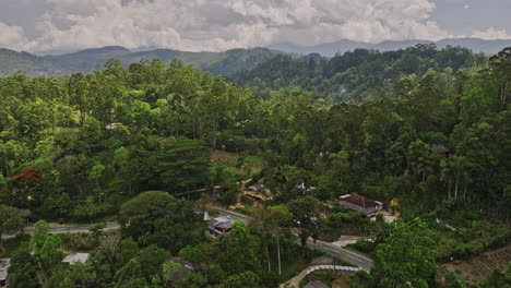 Mirahawatta-Sri-Lanka-Aerial-v1-cinematic-drone-flyover-B44-road-capturing-hillside-residential,-agricultural-farmlands,-jungle-forest-and-mountainous-landscape---Shot-with-Mavic-3-Cine---April-2023