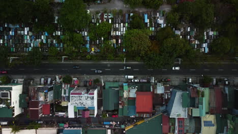 Cars-on-the-South-Avenue-of-Makati,-Philippines---overhead,-drone-shot