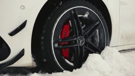 Car-tire-skid-on-dense-snow-and-slippery-road,-winter-drift-event-incident
