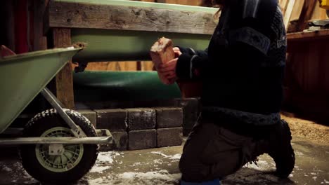 The-Man-is-Placing-Bricks-Beneath-the-DIY-Hot-Tub---Close-Up