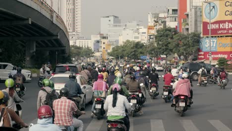 Rush-hour-traffic-with-motorcycles-and-cars-in-Saigon,-traffic-congestion-in-Ho-Chi-Minh-City,-Vietnam