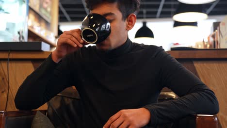 Powerful-man-drinking-coffee-and-thinking,-portrait-view