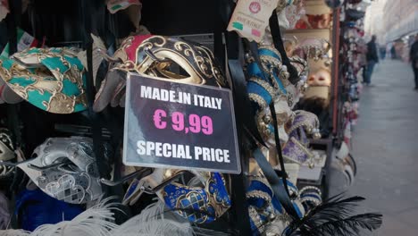 Venetian-masks-on-display,-special-price-tag