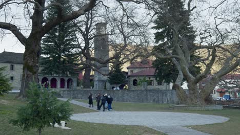 People-attending-Metsovo-village-old-traditional-stone-church-Greece