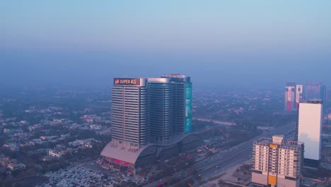 Aerial-view-of-Islamabad-centaurus-Mall-with-busy-roads-and-residential-houses-in-the-background