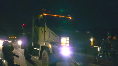 Armored-Tactical-Truck-Leaving-Mass-Shooting-Crime-Scene-At-Night-In-Lewiston,-Maine,-USA