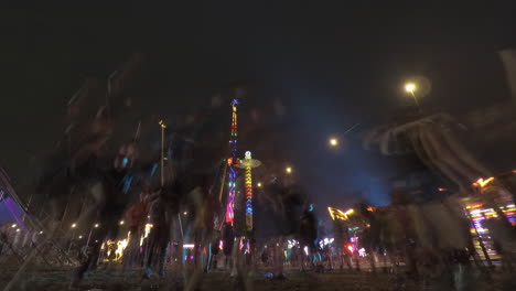 Fair-ground-night-timelapse,-amusementpark-rides-in-background