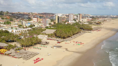 Aerial-view-of-the-beach,-palm-trees-and-the-city-around,-Praia-do-Futuro,-Ceara,-Brazil