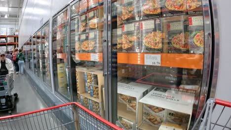 POV---Slowly-pushing-cart-past-freezer-cases-that-contain-frozen-meals-at-local-Costco