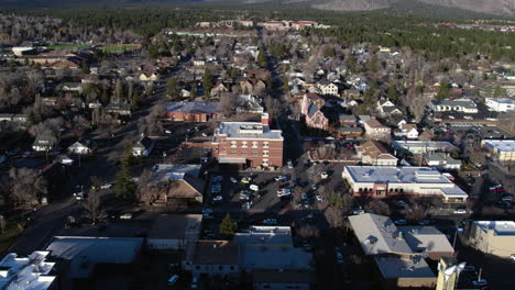 Aerial-View-of-Downtown-Flagstaff,-Arizona-USA-on-Sunny-Winter-Day,-Streets-and-Buildings