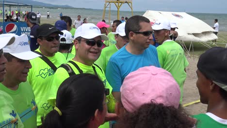 Juan-Orlando-Hernández,-former-president-of-Honduras,-greets-a-group-of-people-during-his-visit-to-the-city-of-Puerto-Cortés