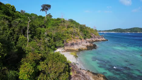 Woman-explores-lonely-dream-beach-on-island