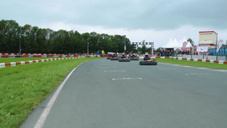 Start-of-karting-race-with-drivers-taking-off-from-starting-position