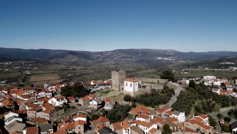 Medieval-Belmonte-Castle-Overlooking-Town,-Portugal---aerial-panoramic