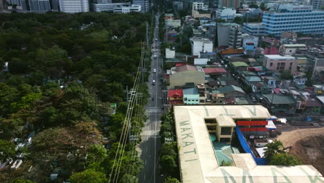 Aerial-view-over-the-south-Ave-and-the-Francisco-Benitez-School,-in-Manila,-Philippines