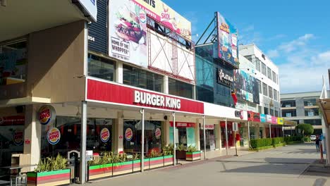 Exterior-view-of-Burger-King-fast-food-restaurant-outlet-and-cinema-complex-at-popular-shopping,-eating-and-entertainment-spot-of-Timor-Plaza-in-capital-city-of-East-Timor,-Southeast-Asia