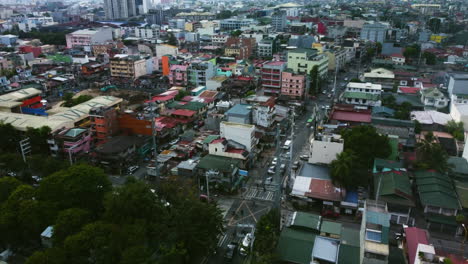 Aerial-view-over-traffic-on-the-Kalayaan-Ave,-cloudy-day-in-Manila,-Philippines