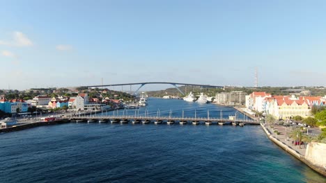 Aerial-establish-dolly-of-Queen-Emma-and-Juliana-bridges-in-Willemstad-Curacao