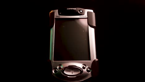 Close-Up-of-Old-Compaq-iPAQ-Pocket-PC-Device-With-Windows-Mobile-System-2000's-Technology