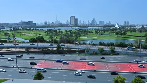 Dubai-Timelapse:-Skyline-view-from-Deira-with-traffic-flowing-on-Airport-Road,-Dubai,-UAE