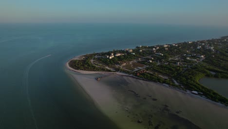 Holbox-island,-mexico-with-lush-greenery-and-beaches-at-dawn,-aerial-view