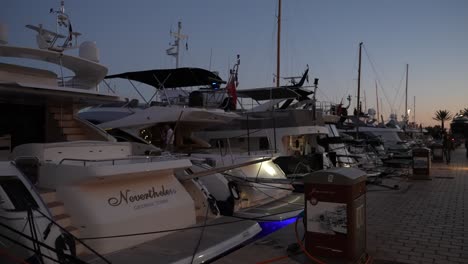 Private-Yach-Boats-at-marine-during-sunset-dusk,-Dolly-walking-forward-shot