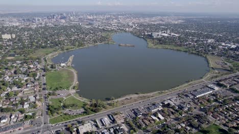 A-4K-high-flying-drone-shot-of-Sloan’s-Lake,-the-biggest-lake-in-the-city-of-Denver,-Colorado,-and-home-to-the-second-largest-park-in-the-city,-and-a-myriad-of-outdoor-activities