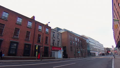 Pearse-St-in-Dublin-2-with-pedestrians-walking-along-sidewalk-under-overcast-sky