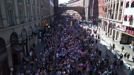 Pride-Parade-2019-seen-from-a-bridge-in-downtown-Stockholm,-Sweden