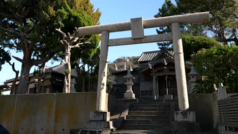 Typical-Japanese-torii-gate-with-shrine,-locked-off-shot