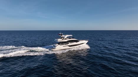 Luxury-yacht-driving-at-sea-with-empty-horizon-in-the-background