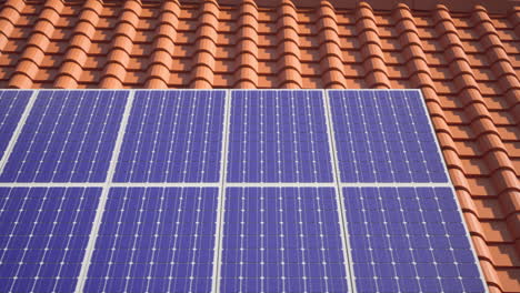 Tracking-left-to-right-shot-of-Solar-panels-modules-on-roof-on-a-clear-sunny-day