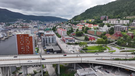 Drone-Shot-of-Bergen,-Norway,-Bridge-and-Street-Traffic,-Residential-Apartment-Buidlings