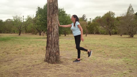 The-Woman-is-Stretching-Her-Quadriceps---Wide-Shot