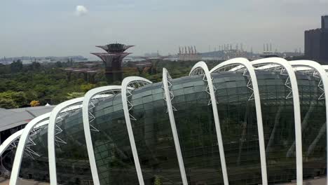 Singapore's-Flower-Dome-Panning-View-from-an-Aerial-Drone-Peering-Over-the-Rooftop-to-Reveal-Gardens-by-the-Bay