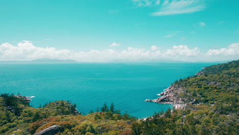 Drone-view-of-the-beach-near-by,-around-Magnetic-Island,-Holiday,-Blue-water