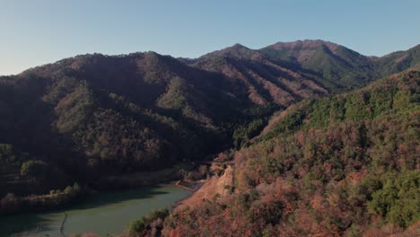 Aerial-Drone-Fly-Japanese-Countryside-Valley-Mountain-Range-Landscape-Skyline-Peaks,-at-Asago,-Hyogo,-Takeda-Castle