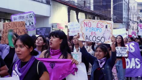 Women-and-girls-carry-placards-at-Women's-Day-March-in-Bolivia